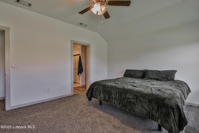 7406 9th St, Lubbock, TX 79416 - carpeted bedroom featuring vaulted ceiling, ceiling fan, baseboards, and ensuite bathroom