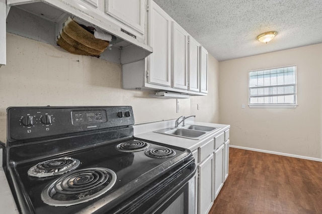 kitchen featuring sink, dark wood-type flooring, white cabinetry, a textured ceiling, and black range with electric cooktop