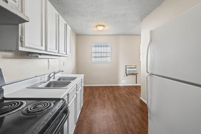 kitchen featuring range with electric cooktop, dark hardwood / wood-style floors, white cabinetry, sink, and white fridge