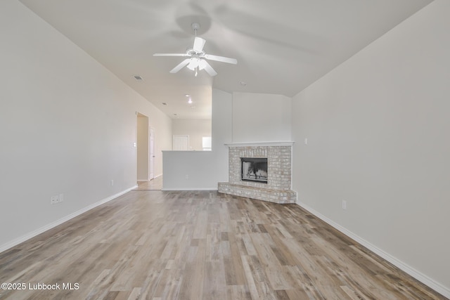 6801 36th St, Lubbock, TX 79407 - unfurnished living room with ceiling fan, wood finished floors, baseboards, and a fireplace