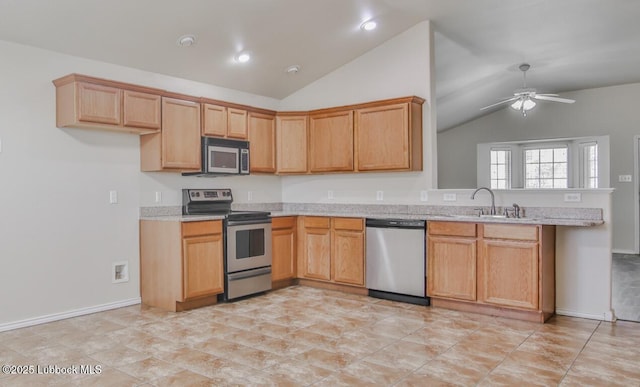 6801 36th St, Lubbock, TX 79407 - kitchen featuring stainless steel appliances, lofted ceiling, a sink, a peninsula, and recessed lighting