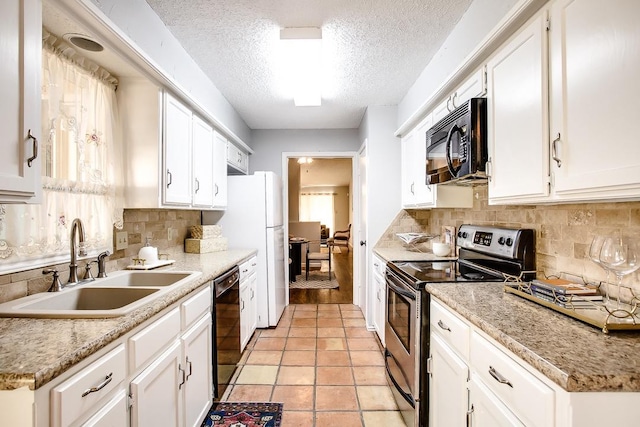 kitchen with sink, white cabinetry, black appliances, a textured ceiling, and backsplash