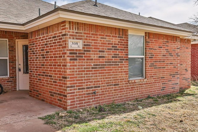 view of side of property with a patio area