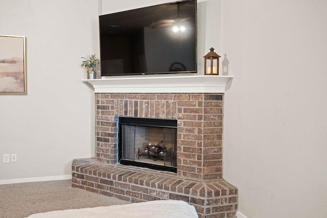 details featuring carpet flooring and a fireplace