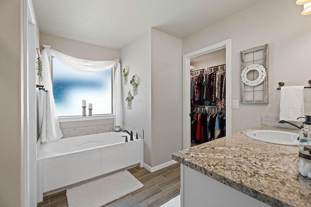 bathroom featuring vanity and a bathing tub