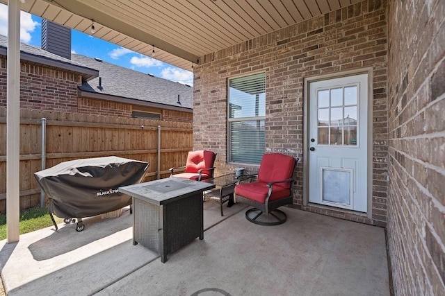 view of patio with an outdoor fire pit