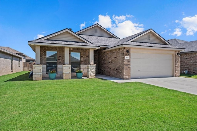 view of front of property with a garage and a front yard