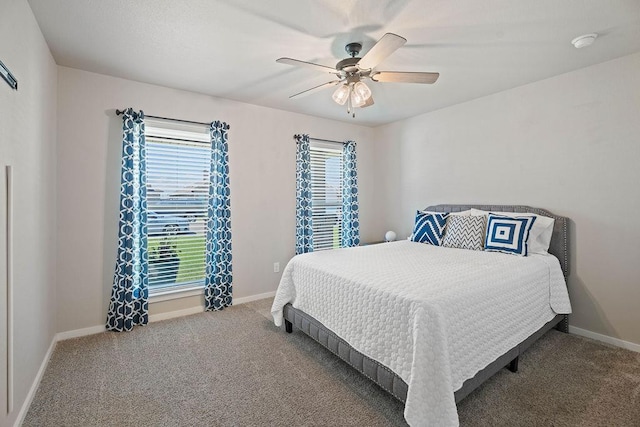 bedroom with ceiling fan and carpet