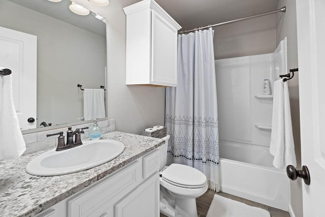 full bathroom with vanity, hardwood / wood-style flooring, toilet, and shower / bath combo