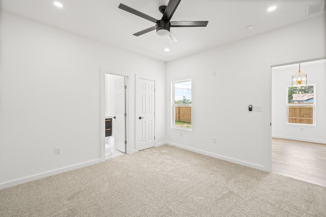 carpeted empty room with ceiling fan