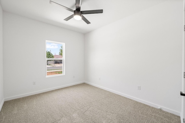 spare room featuring carpet floors and ceiling fan