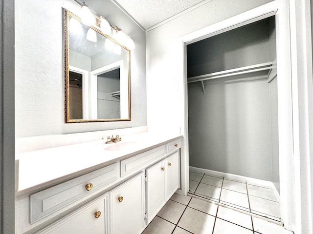 bathroom with vanity, tile patterned flooring, and a textured ceiling