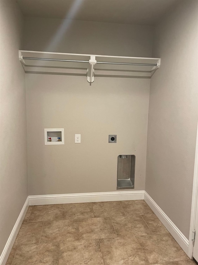 clothes washing area with hookup for a washing machine and hookup for an electric dryer