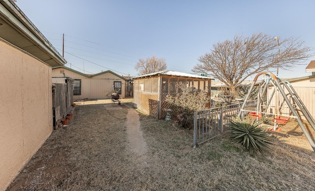 view of yard featuring a sunroom