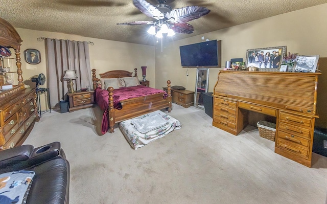 bedroom featuring light colored carpet, a textured ceiling, and ceiling fan