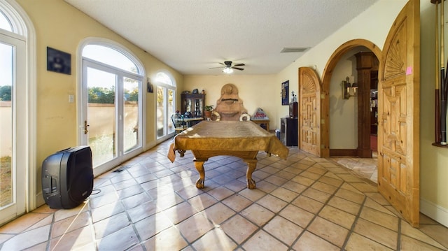 playroom with ceiling fan, billiards, and a textured ceiling