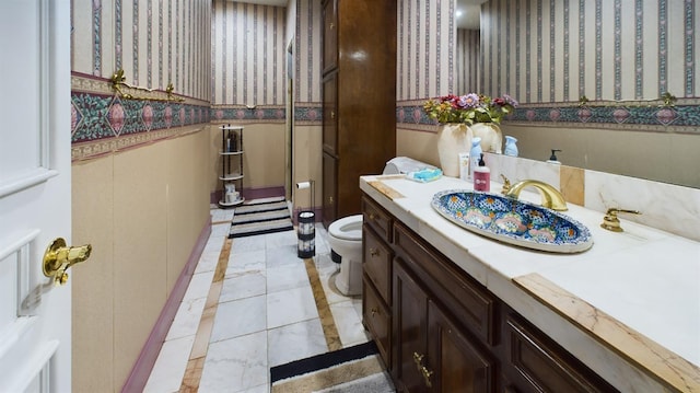 bathroom with vanity and toilet