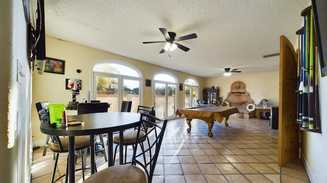 game room featuring light tile patterned flooring, ceiling fan, a textured ceiling, and billiards