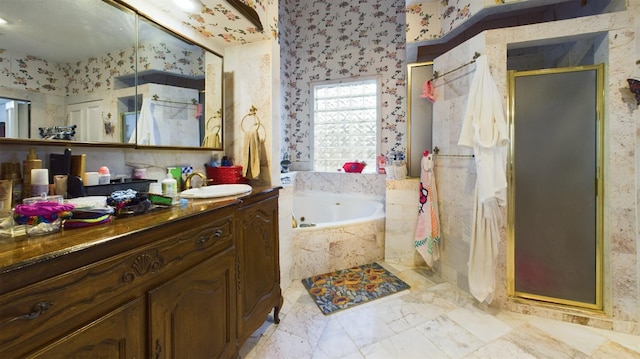 bathroom featuring vanity and independent shower and bath