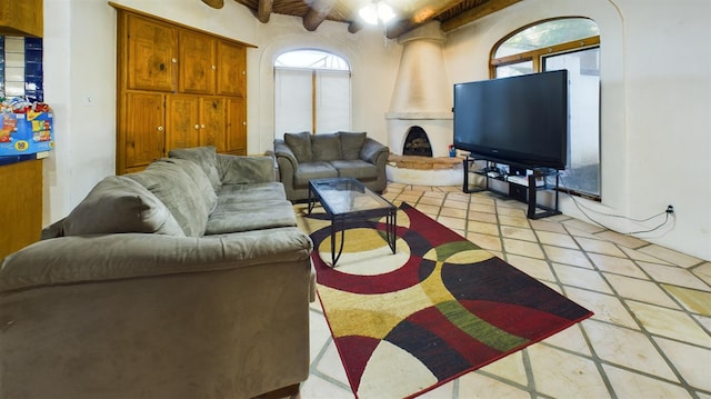 tiled living room with a wealth of natural light and beamed ceiling