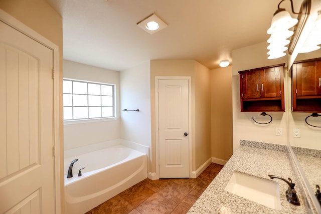 bathroom featuring vanity and a bath