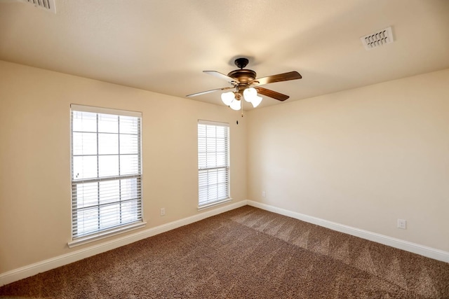 carpeted empty room with ceiling fan