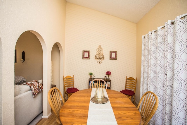 dining room featuring a textured ceiling