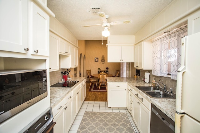 kitchen featuring white cabinetry, sink, and black appliances