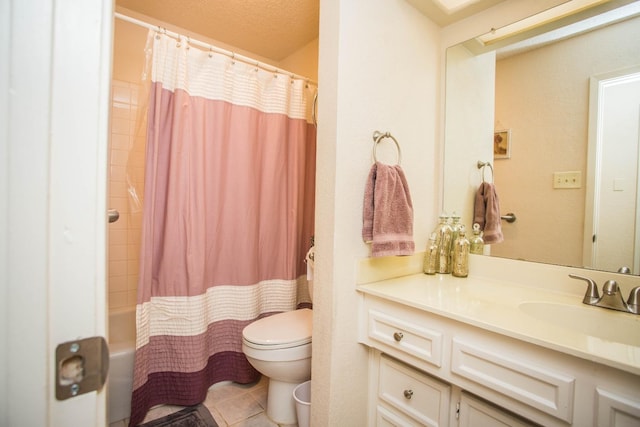 full bathroom with tile patterned floors, vanity, toilet, and shower / bath combo with shower curtain