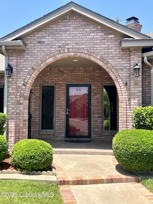 9802 Toledo Ave, Lubbock, TX 79424 - property entrance with brick siding