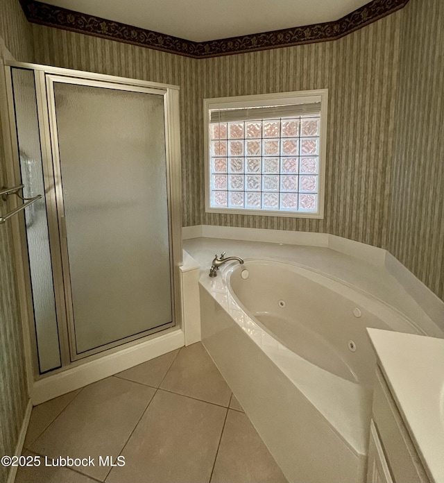 9802 Toledo Ave, Lubbock, TX 79424 - bathroom with wallpapered walls, tile patterned floors, a shower stall, a jetted tub, and vanity