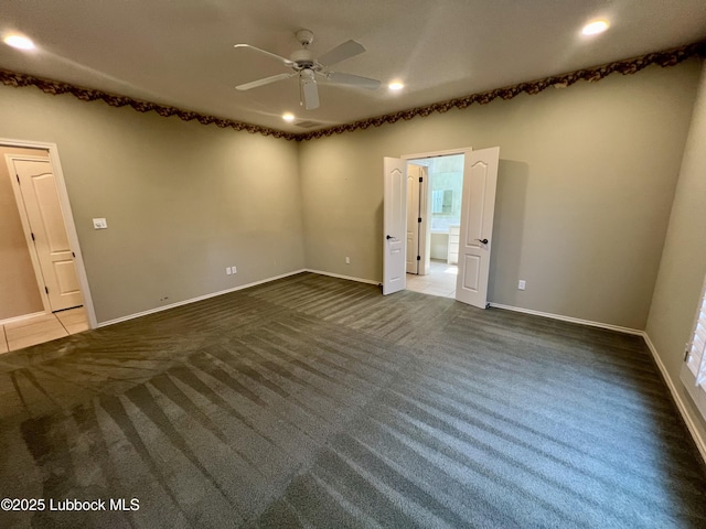 9802 Toledo Ave, Lubbock, TX 79424 - empty room featuring dark colored carpet, ceiling fan, and recessed lighting