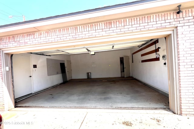 9802 Toledo Ave, Lubbock, TX 79424 - garage featuring a garage door opener