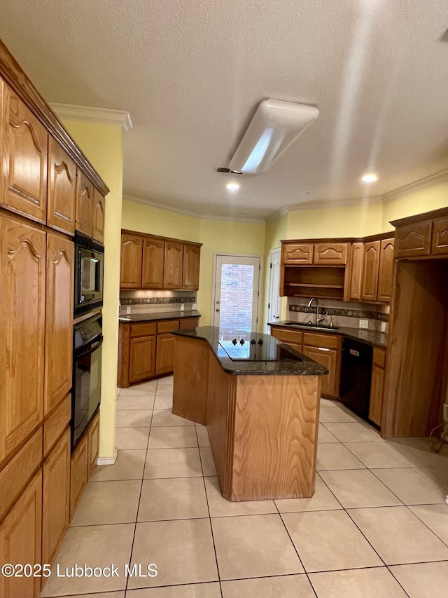 9802 Toledo Ave, Lubbock, TX 79424 - kitchen featuring black appliances, a kitchen island, light tile patterned floors, decorative backsplash, and ornamental molding