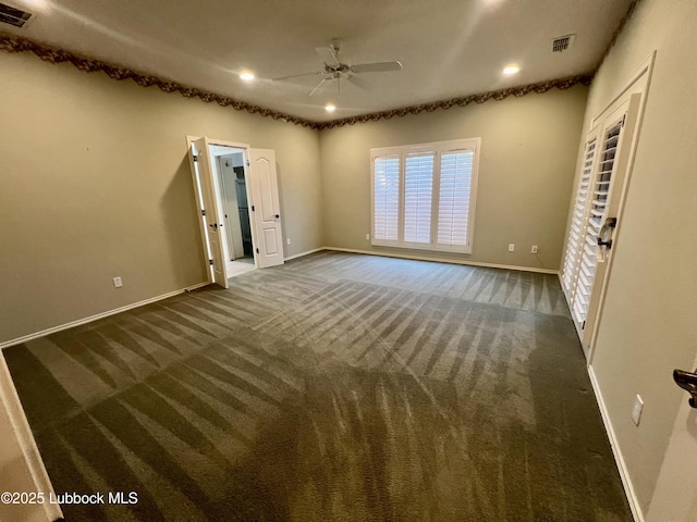 9802 Toledo Ave, Lubbock, TX 79424 - unfurnished room with ceiling fan, dark colored carpet, and recessed lighting