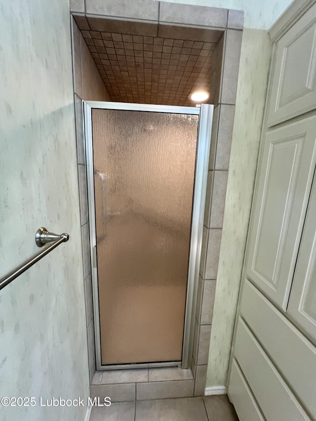 9802 Toledo Ave, Lubbock, TX 79424 - bathroom featuring a stall shower and tile patterned floors