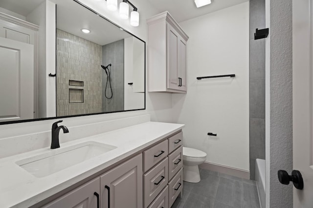 bathroom with vanity, toilet, and tile patterned flooring