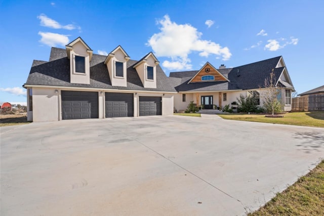 cape cod-style house with a garage