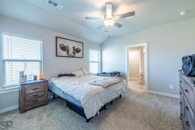 carpeted bedroom with ceiling fan and lofted ceiling