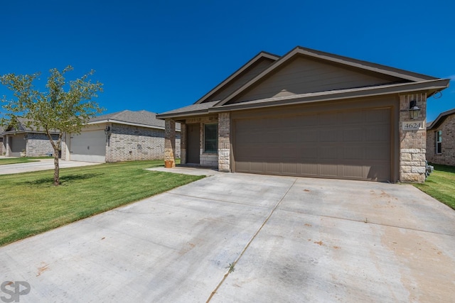 ranch-style home featuring a garage and a front yard