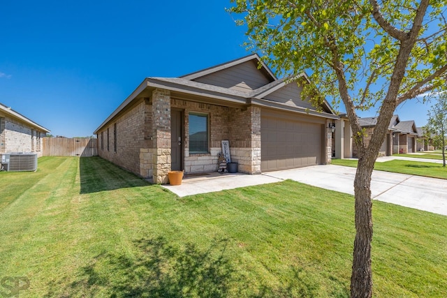 view of front facade featuring central AC unit, a garage, and a front yard