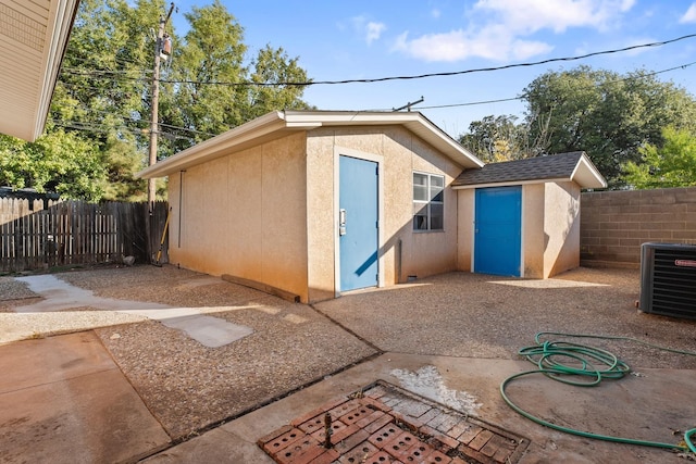 view of outbuilding featuring cooling unit