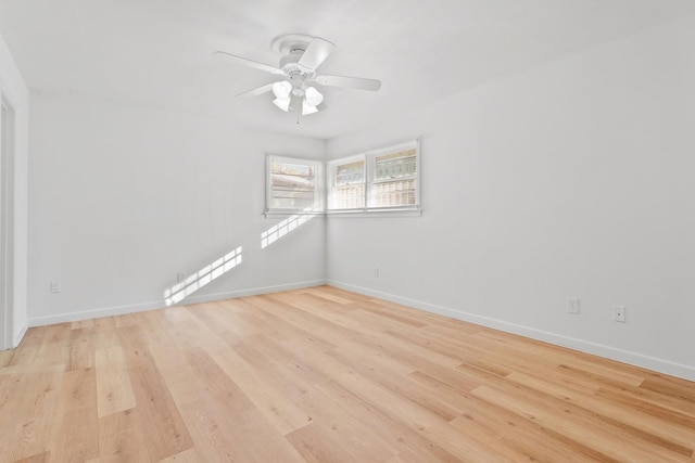 unfurnished room with ceiling fan and light wood-type flooring