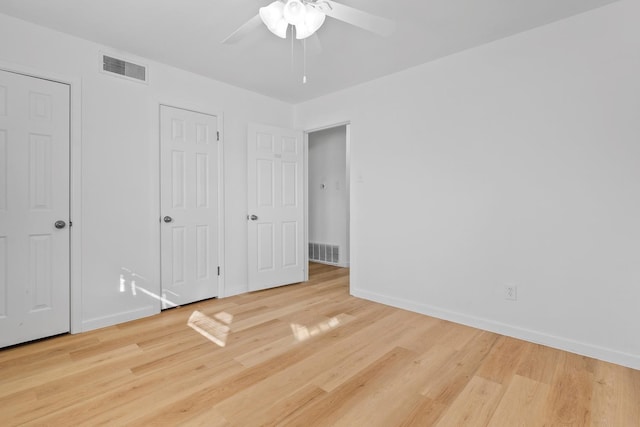 unfurnished bedroom with wood-type flooring and ceiling fan