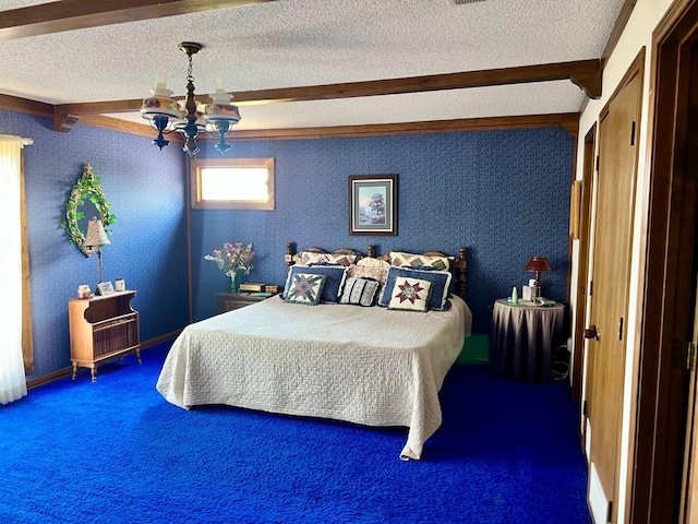 carpeted bedroom featuring beamed ceiling, an inviting chandelier, and a textured ceiling