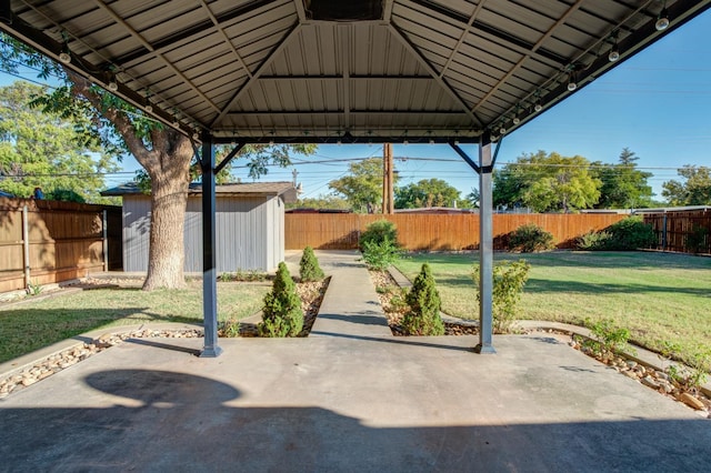 view of patio / terrace with a shed and a gazebo