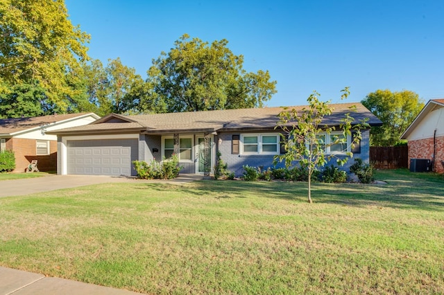 ranch-style home featuring a garage and a front yard