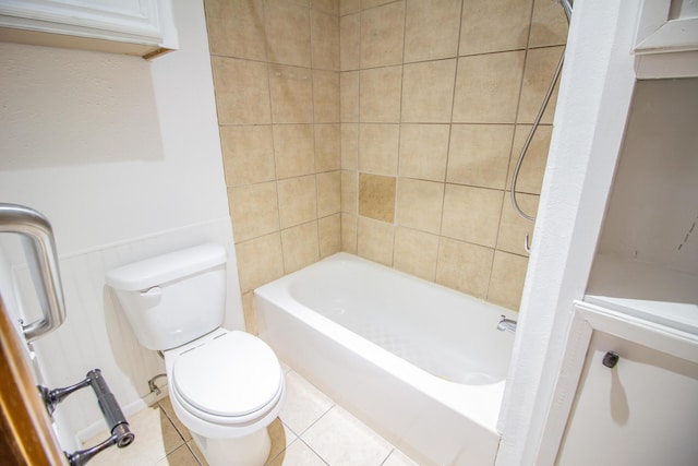 bathroom with toilet,  shower combination, and tile patterned floors