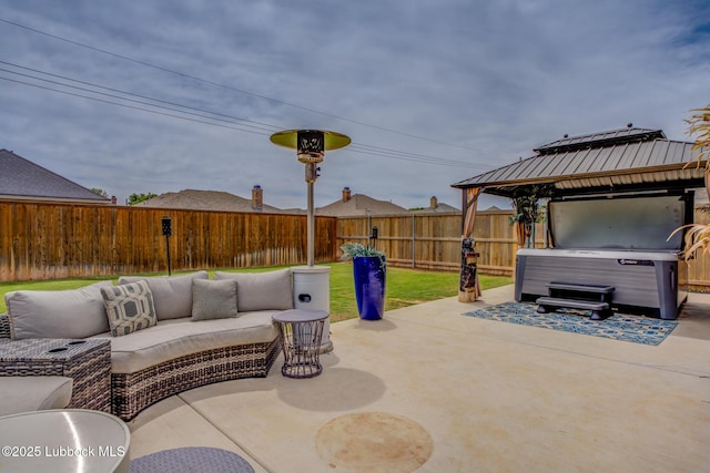 10907 Vicksburg Ave, Lubbock, TX 79424 - view of patio / terrace featuring a hot tub, a gazebo, and an outdoor living space
