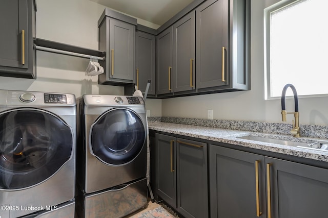 10907 Vicksburg Ave, Lubbock, TX 79424 - laundry room featuring separate washer and dryer and cabinet space